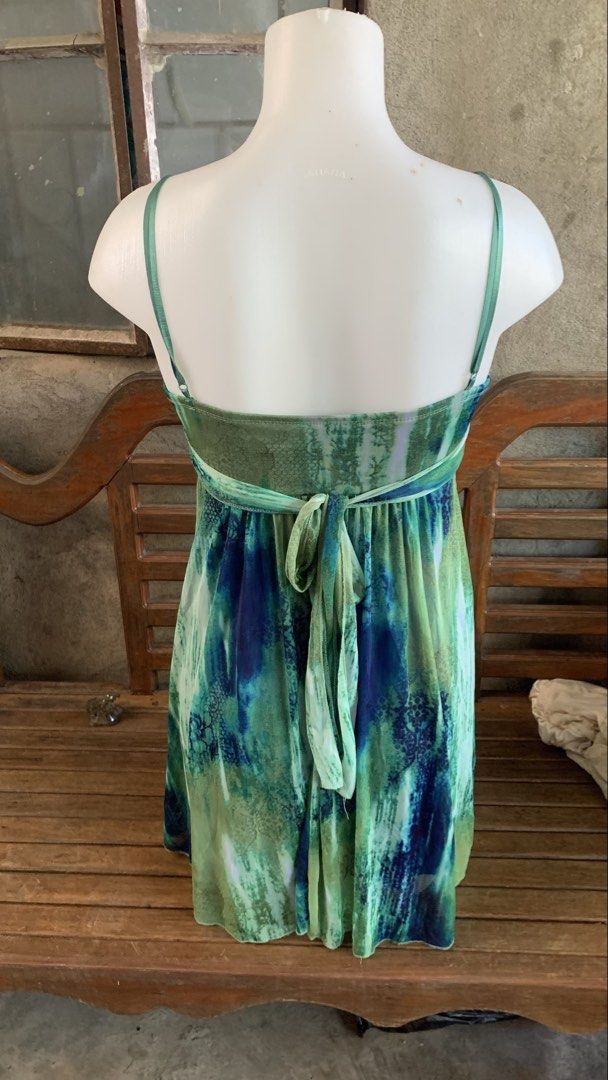 Ruby Rox Blue Green Tie Dye Dress Size S (Category: Dresses) located in Manila. Submitted by thriftnivee (Listing ID 1465782406, Image 3). Description: - Brand: Ruby Rox (Tag attached) - Size: Small - Color/Pattern: Blue and green tie dye - Neckline: V-neck with twisted fabric detail - Straps: Spaghetti straps - Features: Lightweight layered fabric with royal blue lining and adjustable back tie sash -size bust 35 waist 26.