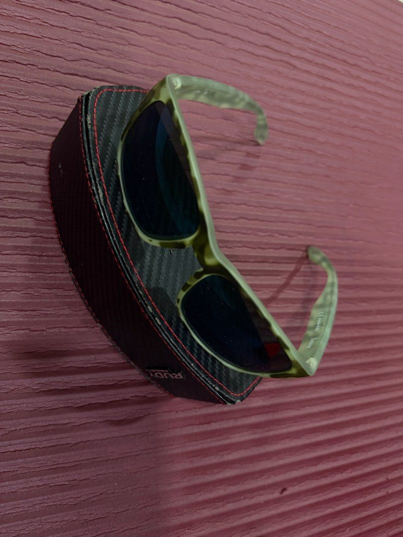 Rudy Project Sensus Sunglasses with Hard Case (Category: Sunglasses & Eyewear) located in Manila. Submitted by imprincessg888 (Listing ID 1465862010, Image 1). Description: - Brand: Rudy Project Sensus - Frame: Stylish green patterned design with dark lenses - Origin: Made in Italy - Condition: Solid build, perfect for outdoor activities and daily wear - Inclusion: Comes with a black carbon-textured hard case featuring red stitching and logo.