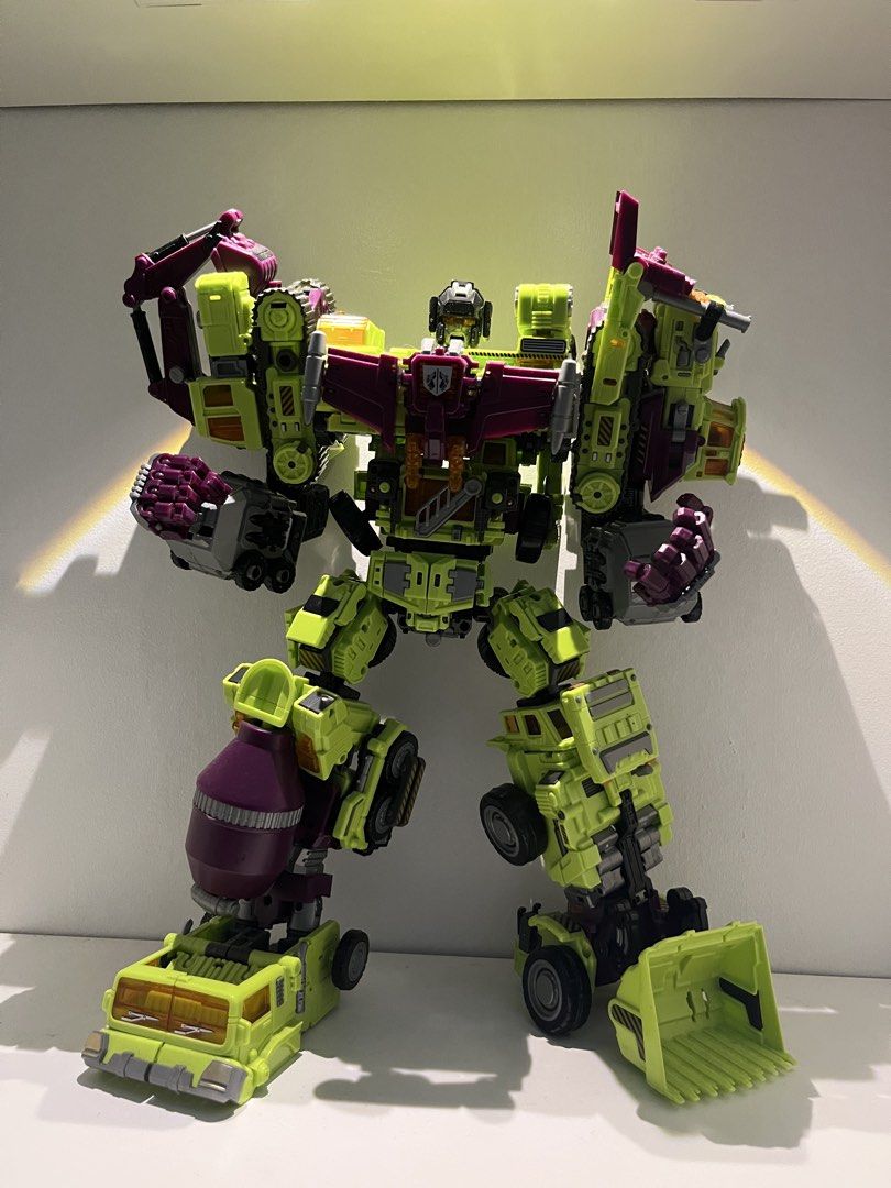 rushsell - NBK Devestator (Category: Action & Battle Toys) located in Quezon City. Submitted by renzo__01 (Listing ID 1465767090, Image 1). Description: -‼️No issues or whatsoever ‼️ - Giant robot toy formed by combining 5 construction vehicles (crane, excavator, cement mixer, dump truck, and loader) - Striking neon green and dark purple color scheme - Excellent display piece for Transformers toy collectors - Sturdy joints hold dynamic poses very