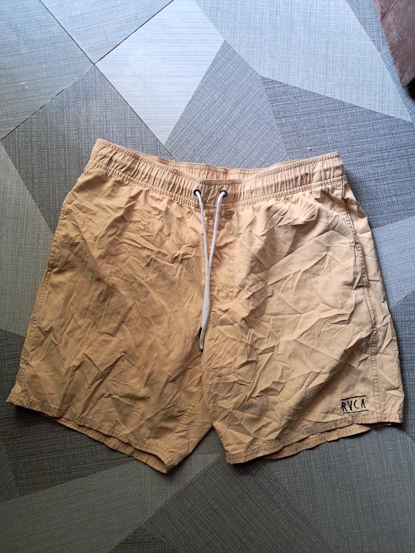 RVCA Yellow Boardshorts Size L (Category: Swim Trunks & Board Shorts) located in Cebu City. Submitted by chill_zy (Listing ID 1465808762, Image 2). Description: - Brand: RVCA - Color: Vibrant Yellow - Size: L - Waistband: Elastic with adjustable white drawstring - Pockets: Convenient back pocket with secure velcro flap and brand patch - Interior: Comfortable mesh lining - Ideal for: Beach days, swimming, or casual everyday wear - Condition: Excel