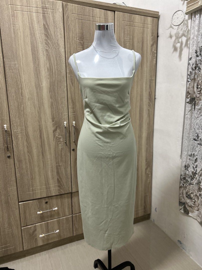 Sage Green Midi Dress Square Neck Spaghetti Strap (Category: Dresses) located in Cavite. Submitted by cl09-39734 (Listing ID 1465818318, Image 3). Description: Sage green midi dress with thin spaghetti straps and a square neckline. Fitted silhouette with subtle ruching across the waist and front. Falls right below the knee. Smooth stretchy fabric. Great option for casual days out or evening dinners..