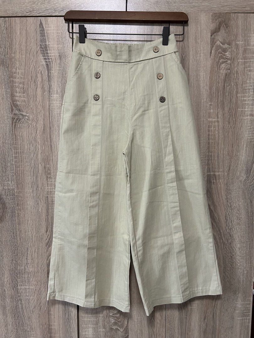 Sage Green Wide-Leg Culottes (Category: Other Bottoms) located in Bulacan. Submitted by relove.re (Listing ID 1465902391, Image 1). Description: Chic and effortlessly classy sage green culottes/palazzo pants featuring: * Size S * High-waist design * Front button detailing * Wide-leg, cropped silhouette * Lightweight fabric — perfect for casual or smart-casual looks * Neutral sage green shade, easy to style ✨ Very good condition Perfect for pairin