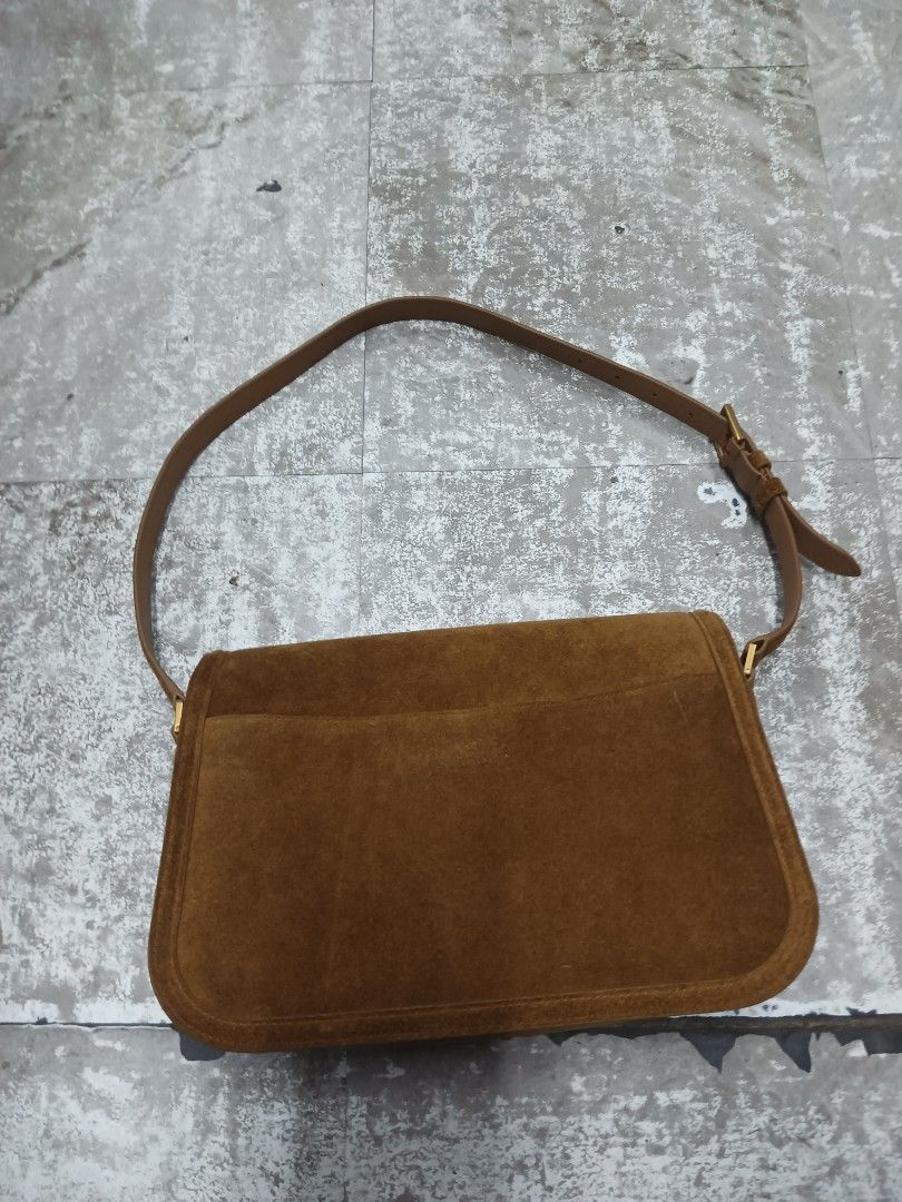 Saint Laurent Solferino Suede Shoulder Bag (Category: Luxury Bags & Wallets) located in Baguio. Submitted by brandeditems16 (Listing ID 1465834753, Image 2). Description: - Brand: Saint Laurent - Material: Premium brown suede - Hardware: Gold-tone - Design: Classic saddle silhouette -Dust with iconic front flap YSL monogram - Strap: Adjustable with buckle closure - Interior: Clean lining with a convenient zipper pocket - Condition: Well-maintaine