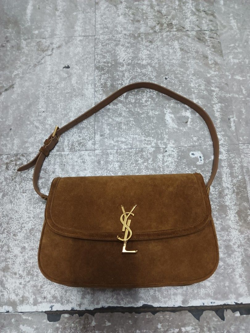 Saint Laurent Solferino Suede Shoulder Bag (Category: Luxury Bags & Wallets) located in Baguio. Submitted by brandeditems16 (Listing ID 1465834753, Image 1). Description: - Brand: Saint Laurent - Material: Premium brown suede - Hardware: Gold-tone - Design: Classic saddle silhouette -Dust with iconic front flap YSL monogram - Strap: Adjustable with buckle closure - Interior: Clean lining with a convenient zipper pocket - Condition: Well-maintaine
