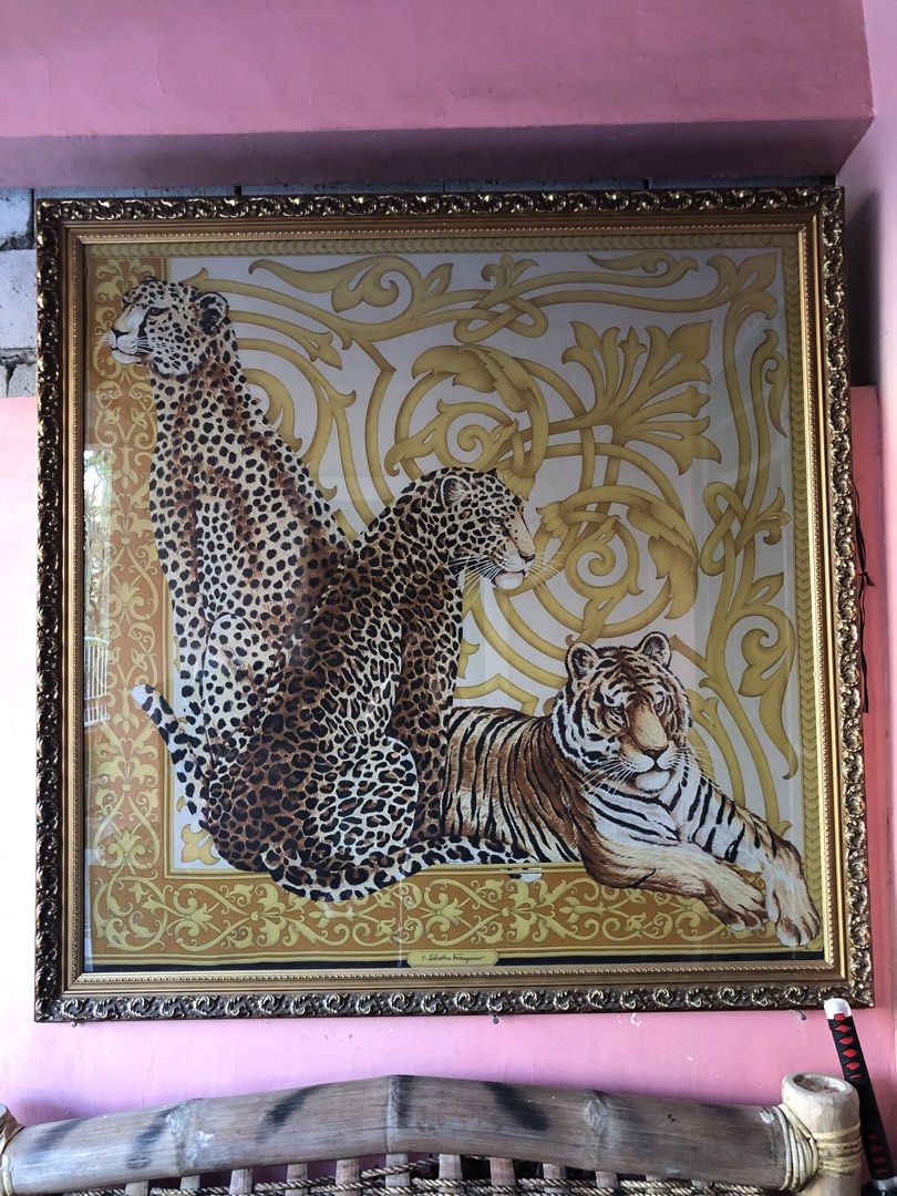 Salvatore Ferragamo vintage frame (Category: Scarves) located in Cavite. Submitted by ai__chang (Listing ID 1465934474, Image 2). Description: - Authentic Salvatore Ferragamo framed silk scarf - Features a bold leopard, cheetah, and tiger design on a gold baroque background - Ornate, textured gold frame included with glass front protection - Generously sized, perfect as a statement home decor piece - Signature Ferragamo branding visible near the 