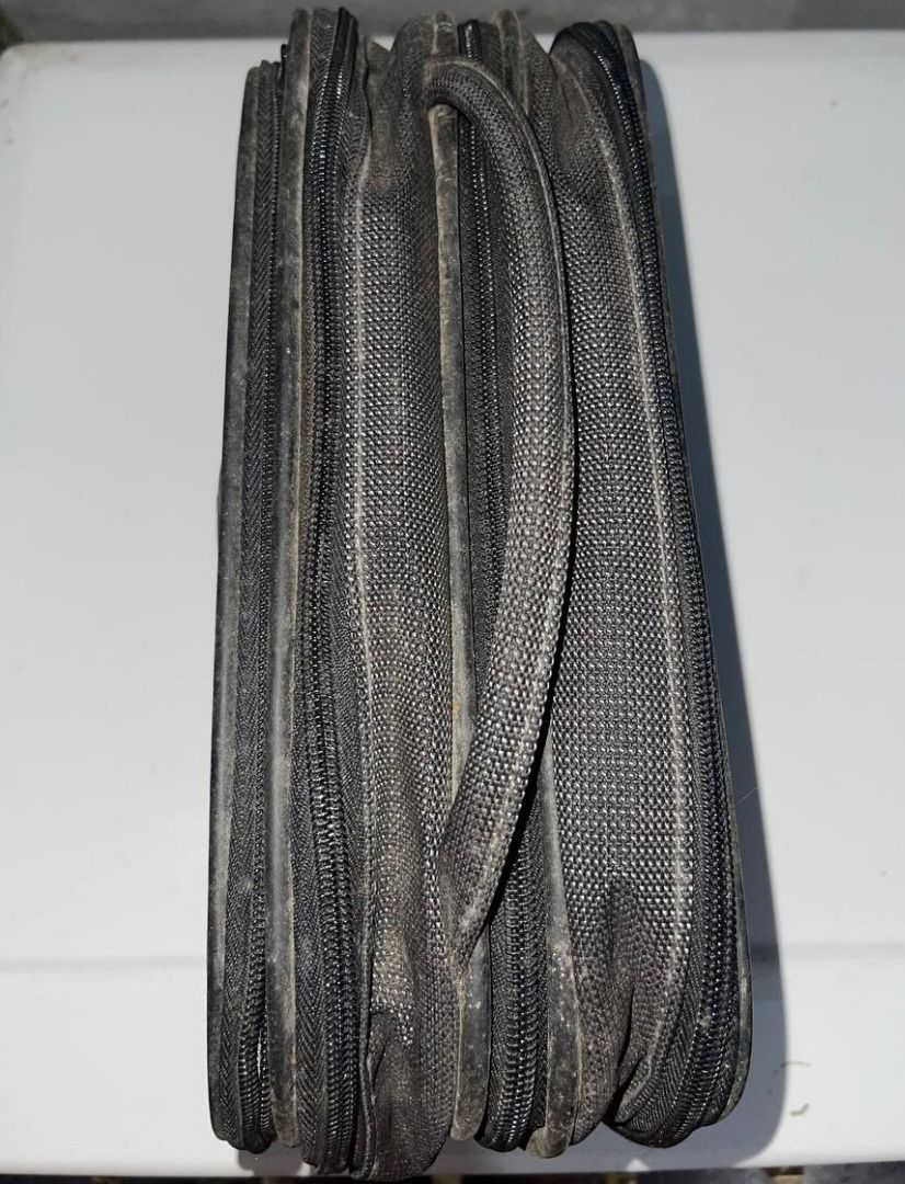 Samsonite Black Travel Pouch (Category: Belt bags, Clutches and Pouches) located in Quezon City. Submitted by randomseller09 (Listing ID 1465891213, Image 3). Description: - Samsonite travel pouch in solid black - Structured rectangular shape with secure zip-around closure and metal zipper pulls - Features a sleek metallic brand logo badge on the front - Textured fabric exterior (please note: shows minor dusty residue and light wear marks) - Stur