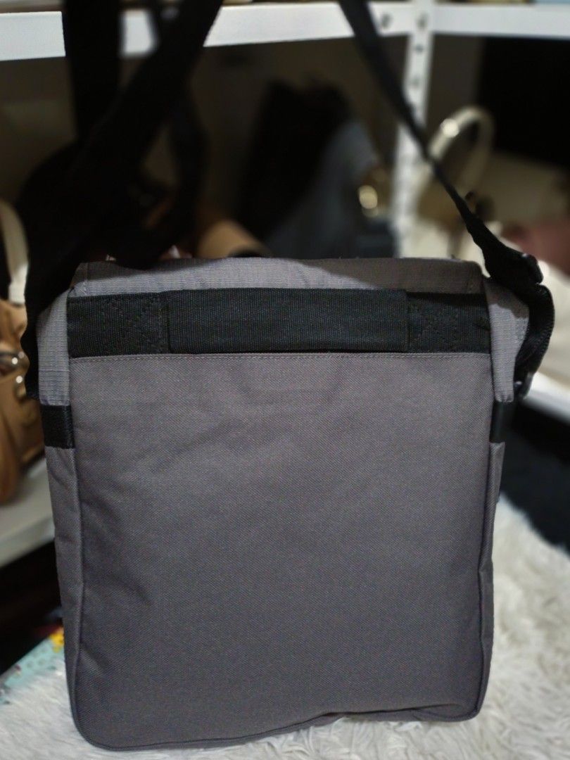 Samsonite Messenger Bag Sling Bag (Category: Sling Bags) located in Bocaue. Submitted by bags.and.beyond (Listing ID 1465887726, Image 2). Description: Samsonite Messenger Bag in a sleek gray color with sporty blue accents and a durable black adjustable crossbody strap. Perfect for daily commuting, school, travel, or casual use. Color: Gray with Blue panels and Black strap Dimensions: 10" x 3" x 12" (Compact yet spacious enough for daily essentia