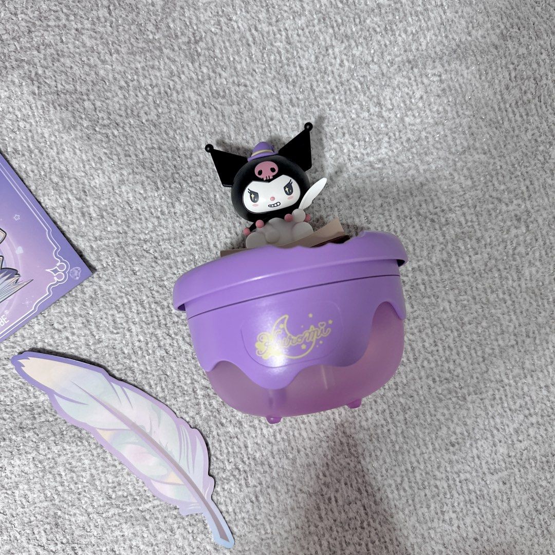 Sanrio Martube Kuromi Magic Book Aroma Diffuser Humidifier (Category: Designer & Blind Box Toys) located in Paranaque City. Submitted by hershey_august (Listing ID 1465939166, Image 2). Description: - Purple Kuromi desktop humidifier and aroma diffuser - Features an adorable Kuromi figure sitting on a spell book - Includes a matching card booklet and holographic feather sticker - USB-powered for easy plug-and-play use - Emits a cute purple glow w