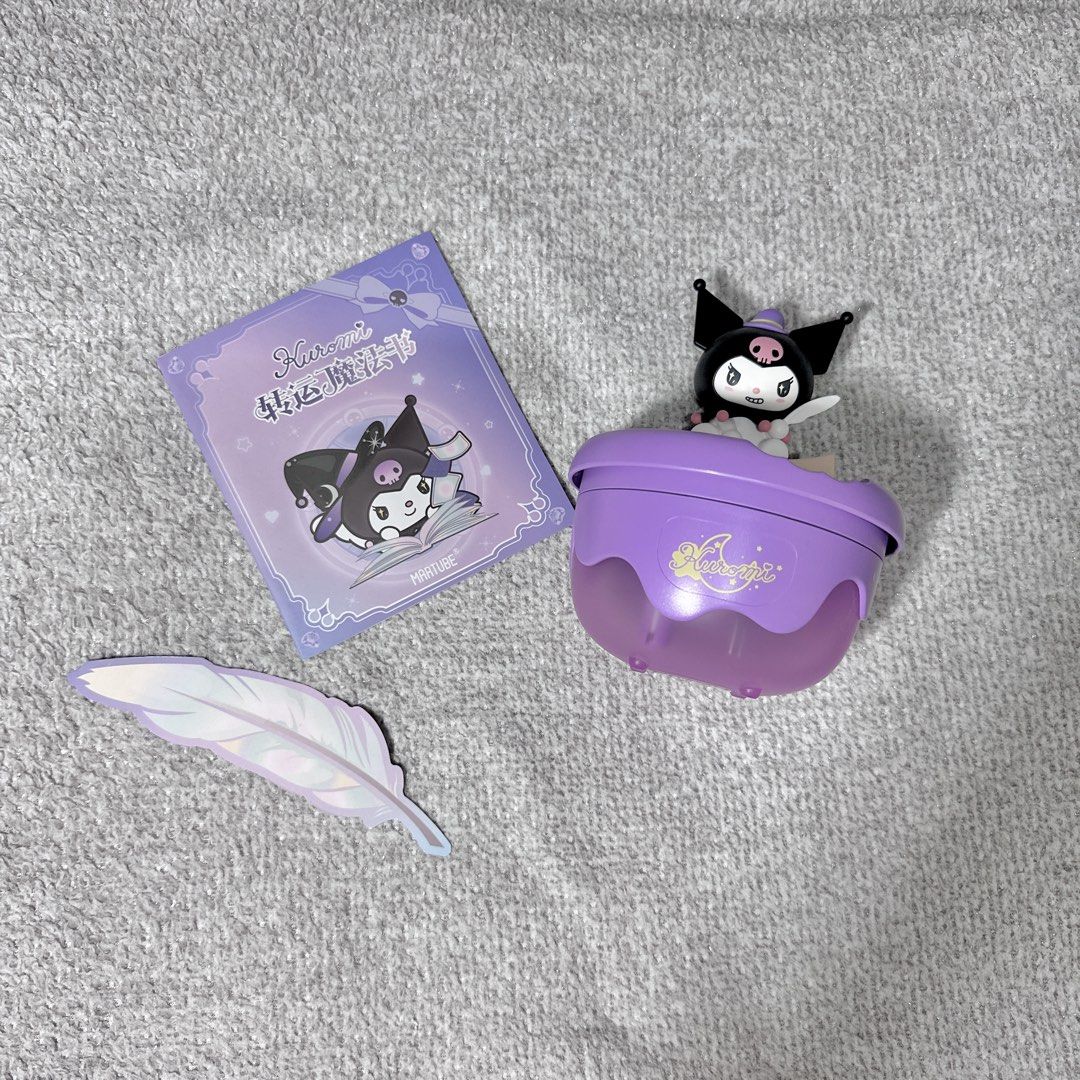 Sanrio Martube Kuromi Magic Book Aroma Diffuser Humidifier (Category: Designer & Blind Box Toys) located in Paranaque City. Submitted by hershey_august (Listing ID 1465939166, Image 3). Description: - Purple Kuromi desktop humidifier and aroma diffuser - Features an adorable Kuromi figure sitting on a spell book - Includes a matching card booklet and holographic feather sticker - USB-powered for easy plug-and-play use - Emits a cute purple glow w