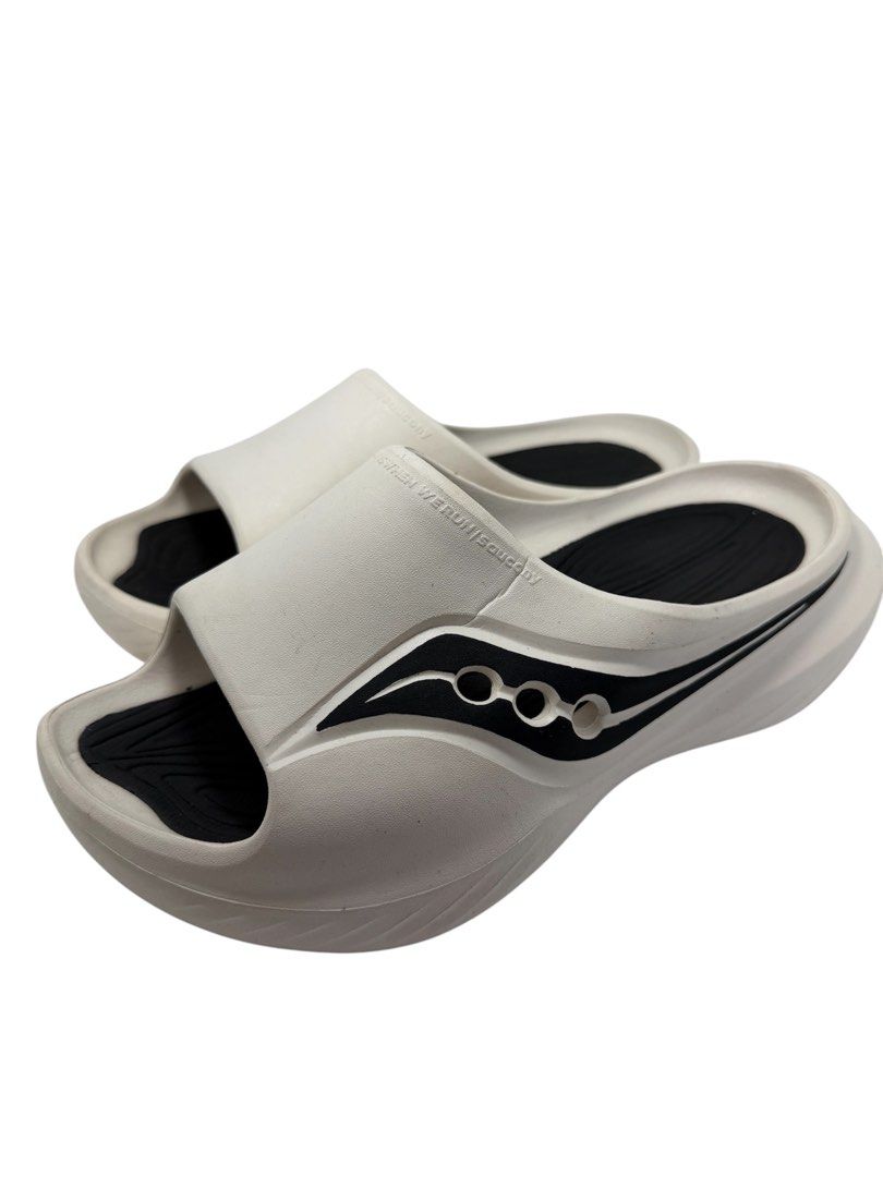 Saucony Unisex Slides (Category: Slippers & Slides) located in Baguio. Submitted by jerome09965737 (Listing ID 1465950364, Image 3). Description: - Brand: Saucony - Style: Slide sandals, slip-on - Color: White and black - Size: US 8.5 / UK 7.5 / EUR 42 - Gender: Unisex - Features: Cushioned footbed, textured outsole, brand logo on side and strap - Condition: Normal wear on the soles.