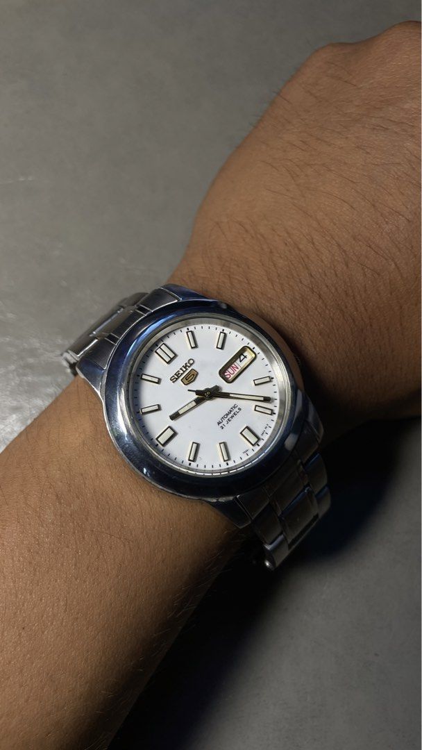 Seiko 5 White Dial (Category: Luxury Watches) located in Urdaneta. Submitted by aeonix2024 (Listing ID 1451991071, Image 2). Description: 📌 Details & Specs: • 38mm • Automatic Movement • Stainless Steel Bracelet • Day & Date Function • Japan Made ✨ Condition: ✅ Timegrapher Tested ✅9.5/10 ✅ Good working condition ✅ Ready to wear 📦 Shipping: J&T / LBC (COD or COP) available 📍 Location: Pangasinan ⚠️ Disclaimer: Pre-owned watch. Expect minor sign