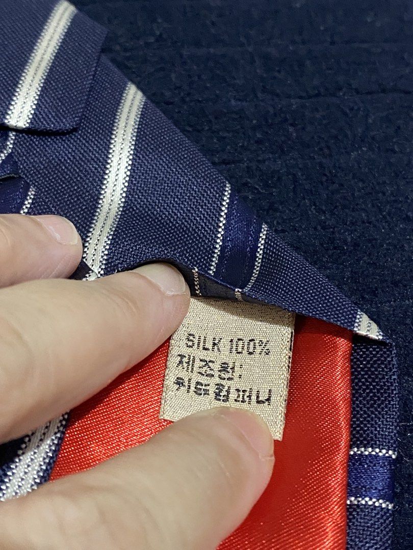 Severino Italy 100% Silk Striped Tie (Category: Ties) located in Manila. Submitted by resi.diaz (Listing ID 1465856607, Image 3). Description: - Brand: Severino (Made in Italy) - Material: 100% pure silk with smooth textured finish - Design: Classic navy blue with diagonal white and blue stripes - Size: Standard width necktie - Condition: Excellent, clean fabric with no stains or loose threads - Ideal for: Business meetings, formal events, and of