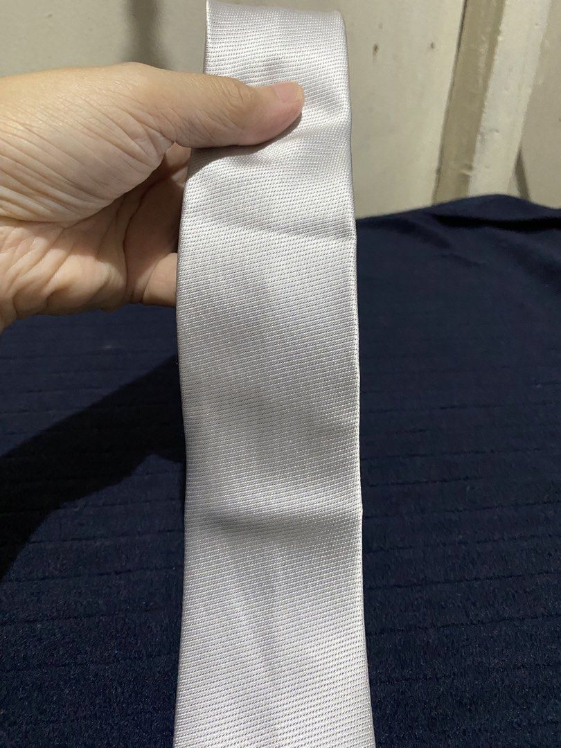 Severino Italy 100% Silk Tie White Silver (Category: Ties) located in Manila. Submitted by resi.diaz (Listing ID 1465896553, Image 2). Description: - Brand: Severino Italy - Material: 100% pure silk with textured weave - Color: Solid white / very light silver - Width: Classic - Condition: Excellent, clean, no stains or pulls - Ideal for: Weddings, formal events, and office wear.