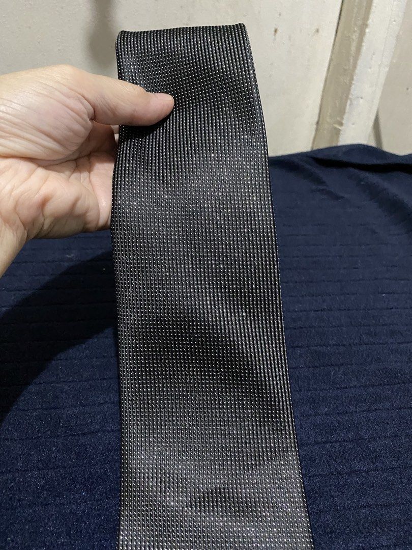 Severino Italy Black Microfiber Necktie (Category: Ties) located in Manila. Submitted by resi.diaz (Listing ID 1465892643, Image 2). Description: - Brand: Severino Italy - Color/Pattern: Black with fine textured dot pattern - Material: 100% premium microfiber - Width: Standard blade - Condition: Clean stitching and high-quality fabric - Versatility: Ideal for work, formal events, and interviews - Styling: Easily matches with white or blue dress s