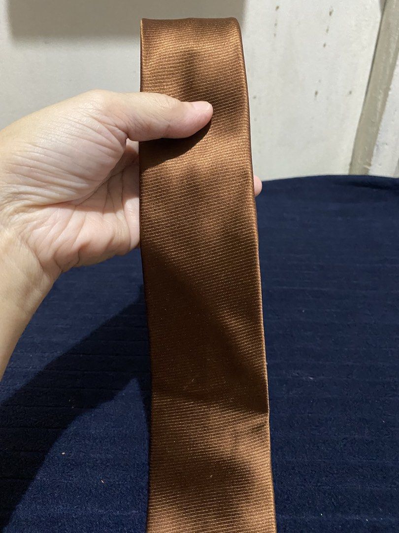 Severino Italy Brown Silk Tie (Category: Ties) located in Manila. Submitted by resi.diaz (Listing ID 1465862622, Image 2). Description: - Brand: Severino Italy - Material: 100% Pure Silk - Color: Solid Brown with textured ribbed finish - Style: Classic width blade, standard adult length - Condition: Clean stitching and excellent quality construction.