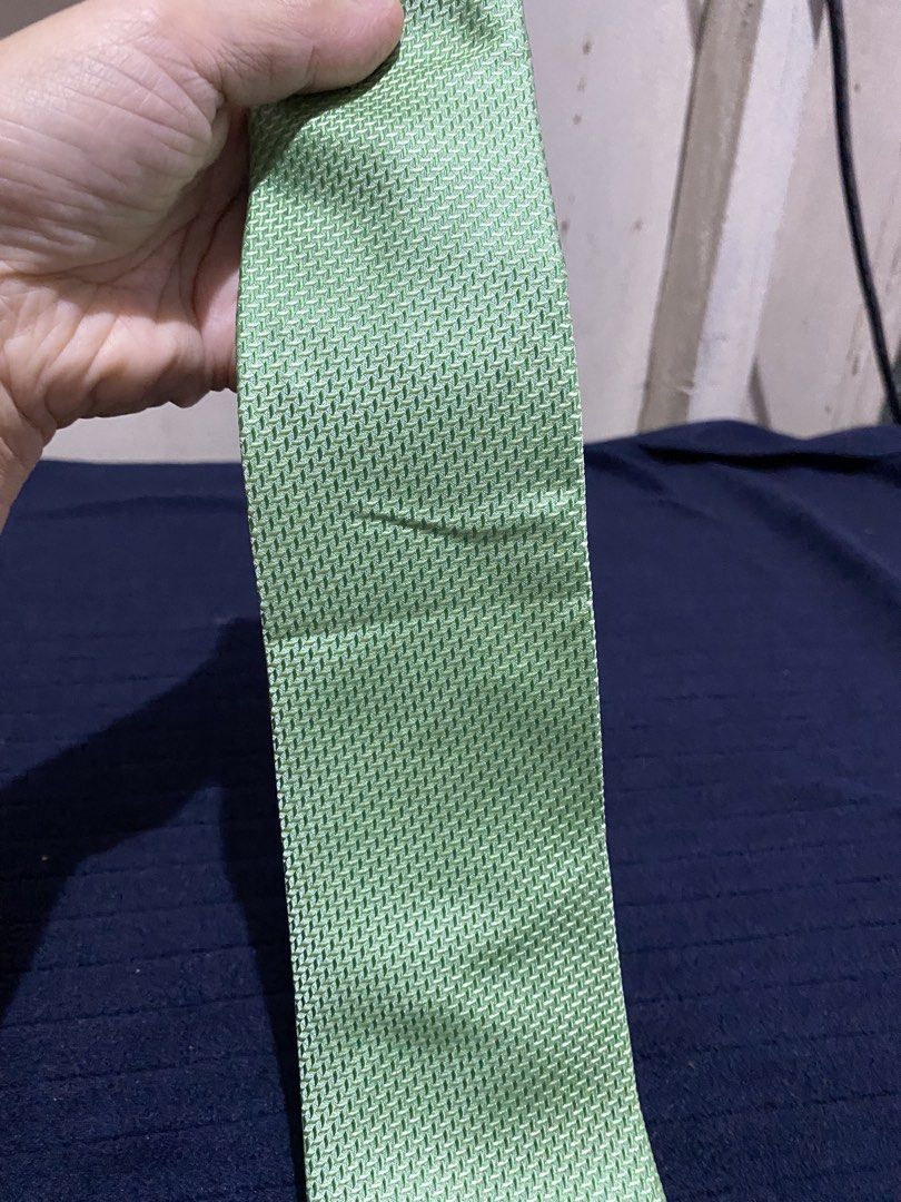 Severino Italy Green Silk Tie (Category: Ties) located in Manila. Submitted by resi.diaz (Listing ID 1465891735, Image 2). Description: - Brand: Severino Italy - Material: Premium green silk with a textured weave pattern - Style: Standard width with a pointed tip - Detail: Unique purple lining on the back loop - Condition: Excellent, clean fabric with no stains or pulls.