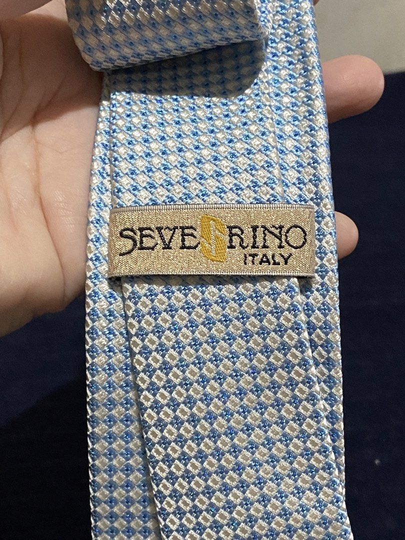 Severino Italy Silk Tie Blue White Checked (Category: Ties) located in Manila. Submitted by resi.diaz (Listing ID 1465858085, Image 2). Description: - Brand: Severino Italy - Design: Blue and white checked pattern with a nice textured weave - Material: 100% pure silk - Shape: Standard necktie with pointed tip - Condition: Excellent, with clean labels stitched on the back - Perfect for office wear, weddings, or formal occasions.