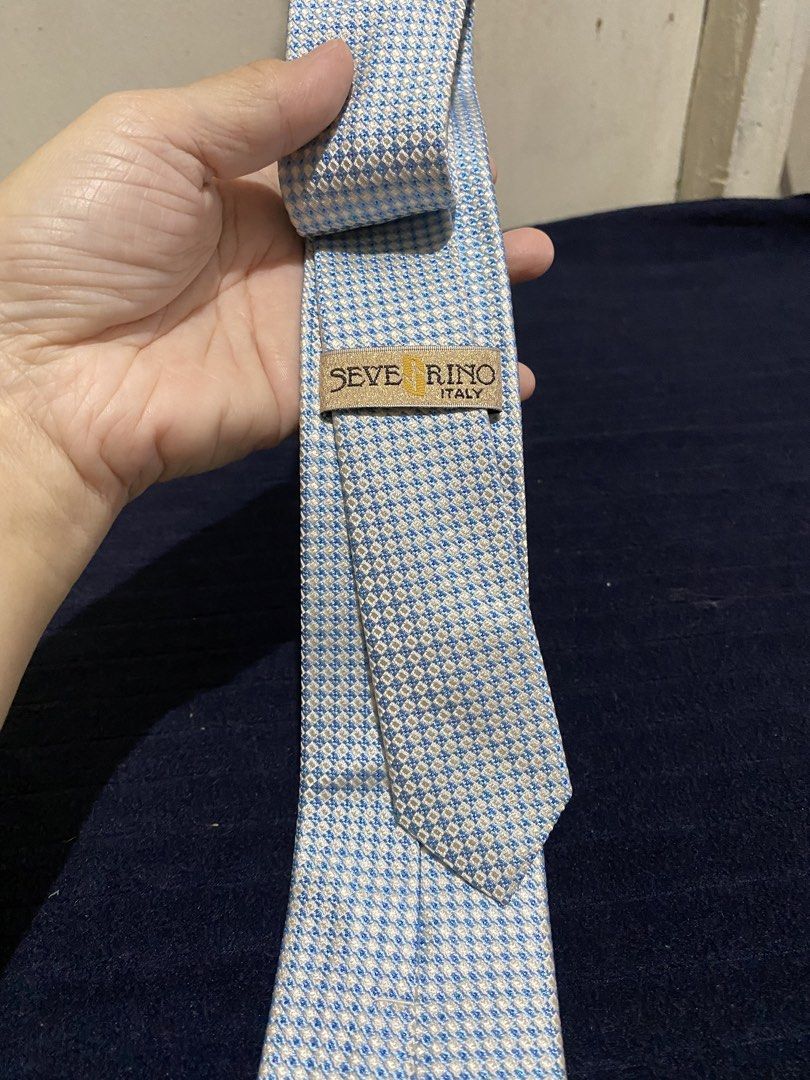 Severino Italy Silk Tie Blue White Checked (Category: Ties) located in Manila. Submitted by resi.diaz (Listing ID 1465858085, Image 1). Description: - Brand: Severino Italy - Design: Blue and white checked pattern with a nice textured weave - Material: 100% pure silk - Shape: Standard necktie with pointed tip - Condition: Excellent, with clean labels stitched on the back - Perfect for office wear, weddings, or formal occasions.