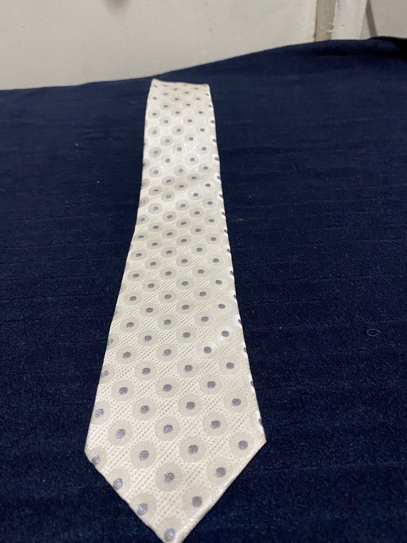 Severino Italy Silk Tie Cream Polka Dot (Category: Ties) located in Manila. Submitted by resi.diaz (Listing ID 1465861326, Image 1). Description: - Brand: Severino Italy - Color/Pattern: Cream with dots and geometric circles - Material: 100% pure silk, made in Korea - Size: Standard width necktie - Condition: Clean, no stains or damage - Best for: Formal events, weddings, and office wear.
