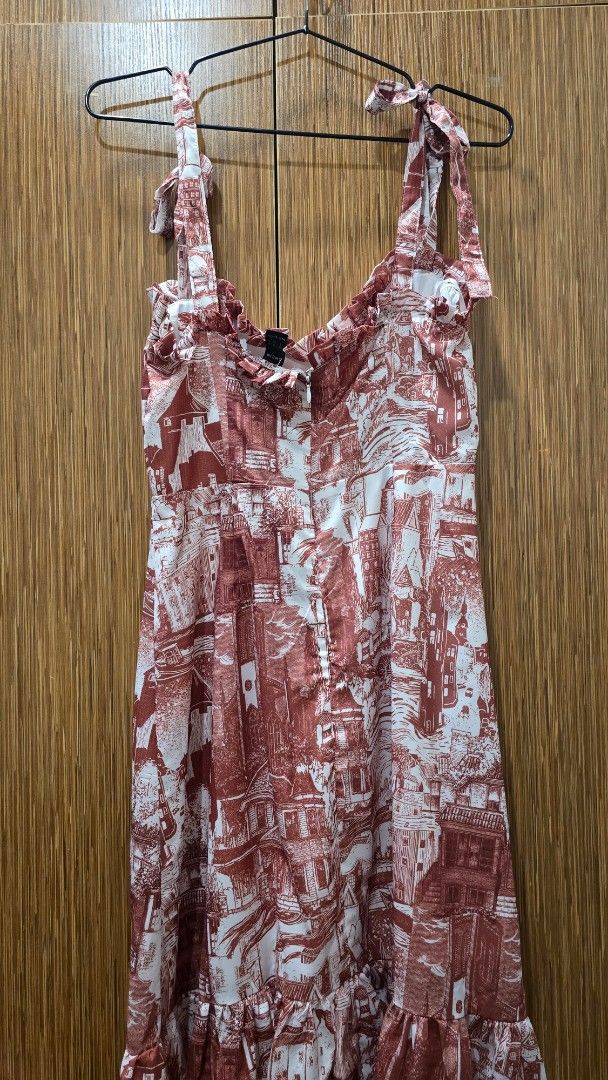 Shein Brown Midi Dress (Category: Dresses) located in Cebu City. Submitted by kitty_12345_ (Listing ID 1465911827, Image 3). Description: - Brand: Shein - Size: Small (S) - Design: Brown and white toile de jouy village print - Details: Square neckline, self-tie shoulder straps, ruffled trim - Fit: Fitted bodice with side zipper closure, flared tiered skirt MOP: gcash, mari, maya, gotyme MOD: Lbc, maxim Meetup: Parkmall.