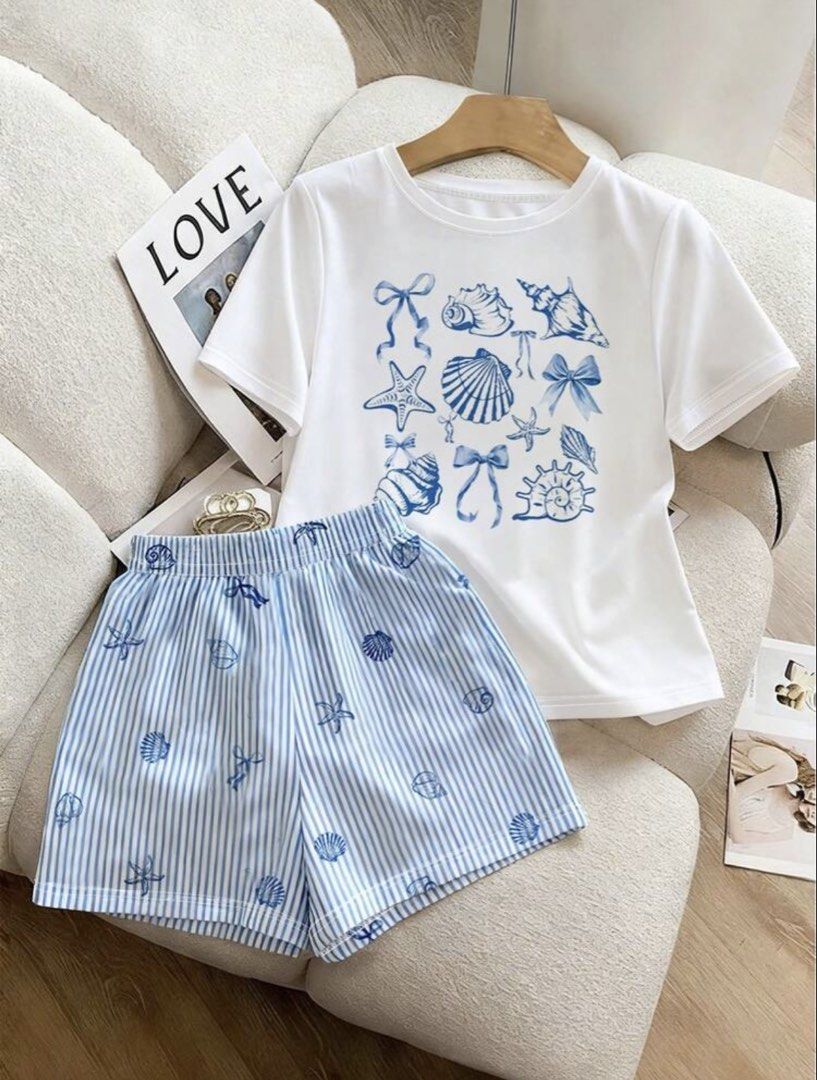 Shein White Coquette Seashell Print Shirt (Category: Sets or Coordinates) located in Manila. Submitted by dianafayesimbre (Listing ID 1465831810, Image 2). Description: - Size: 12Y on tag but fits xxs to semi medium on womens - Details: Cute nautical shell and bow graphics on tee - Condition: Brand new.