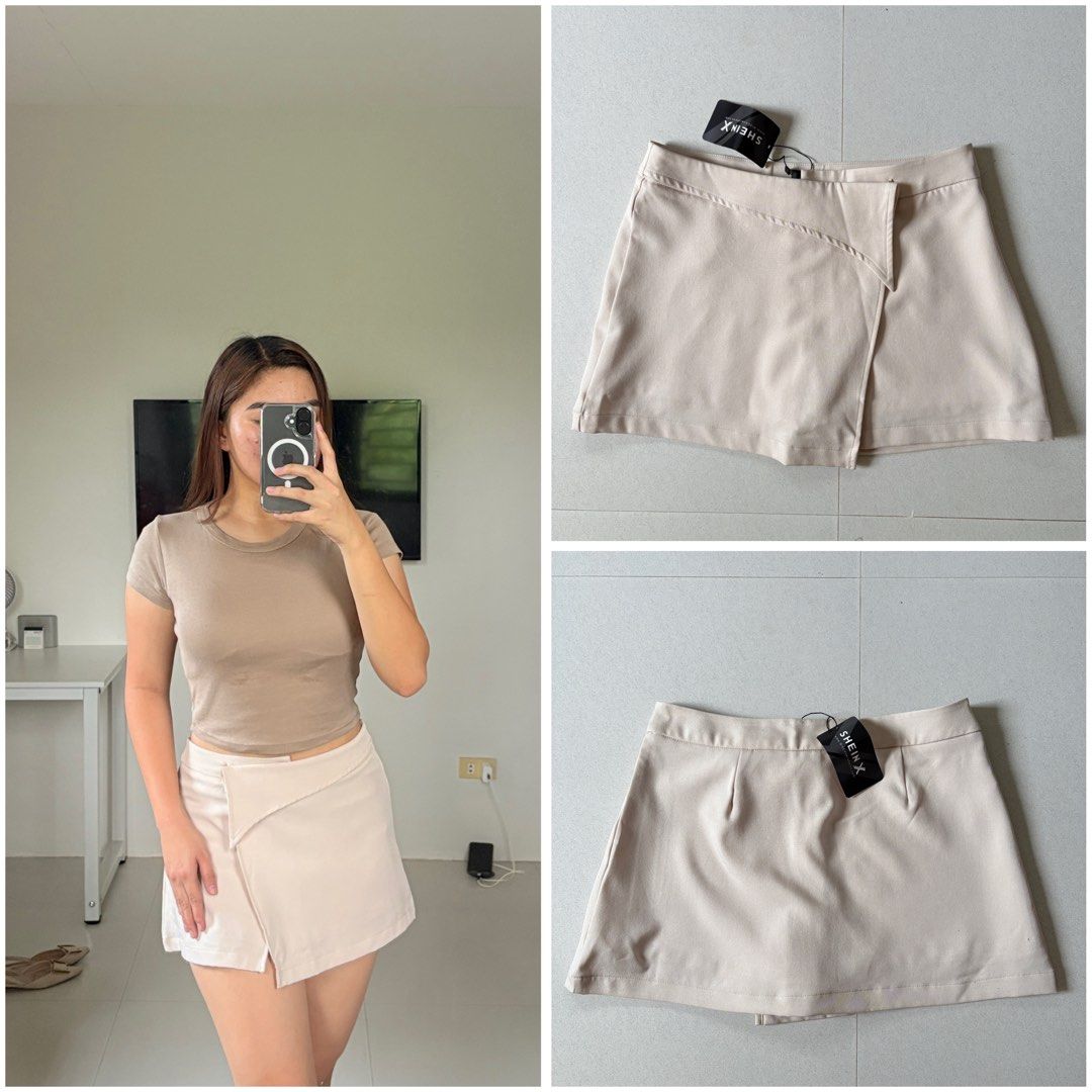 SHEIN X Asymmetric Skort (Category: Skirts) located in San Jose. Submitted by ikonicaura (Listing ID 1465858441, Image 1). Description: - Brand new with tags (BNWT) - Color: Nude Beige - Style: Asymmetric wrap miniskirt with built-in shorts for worry-free movement - Fit: True to size.