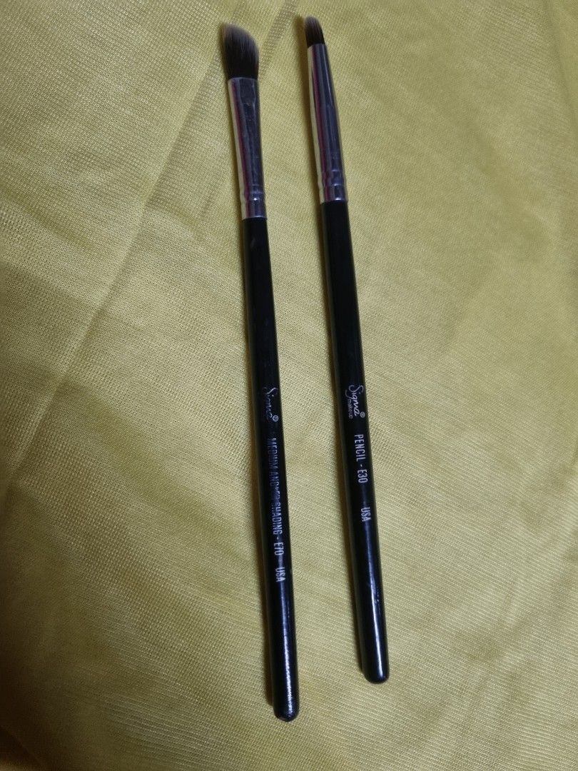 Sigma E70 Medium Angled Shading and E30 Pencil Brushes (Category: Makeup) located in Manila. Submitted by monya111 (Listing ID 1465763292, Image 1). Description: - Authentic Two Sigma eye makeup brush set - Includes E70 Medium Angled Shading brush and E30 Pencil brush - Sleek black handles with silver ferrules and white brand lettering - Perfect for precise eyeshadow application, detailing, and seamless blending - Cleaned and sanitized, ready for