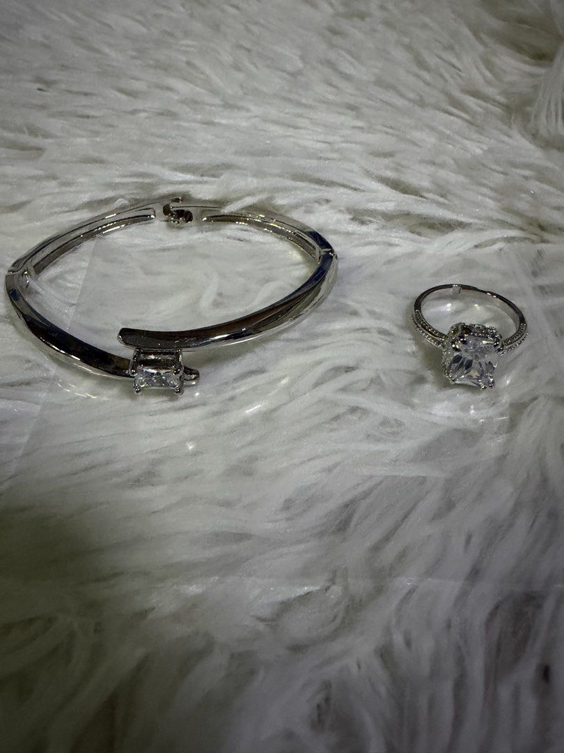 Silver Bracelet And Ring With Clear Crystals (Category: Bracelets) located in Pasig City. Submitted by aprilluxcloset0812 (Listing ID 1465919793, Image 1). Description: - Matching silver-tone bracelet and ring set - Sparkling clear cubic zirconia stones - Bracelet: hinged clasp closure for easy wear - Ring: large rectangular center stone with pavé band RFS: decluttering EVERYTHING MUST GO‼️Just make a reasonable offer ❤️ All items ON HAND, handle