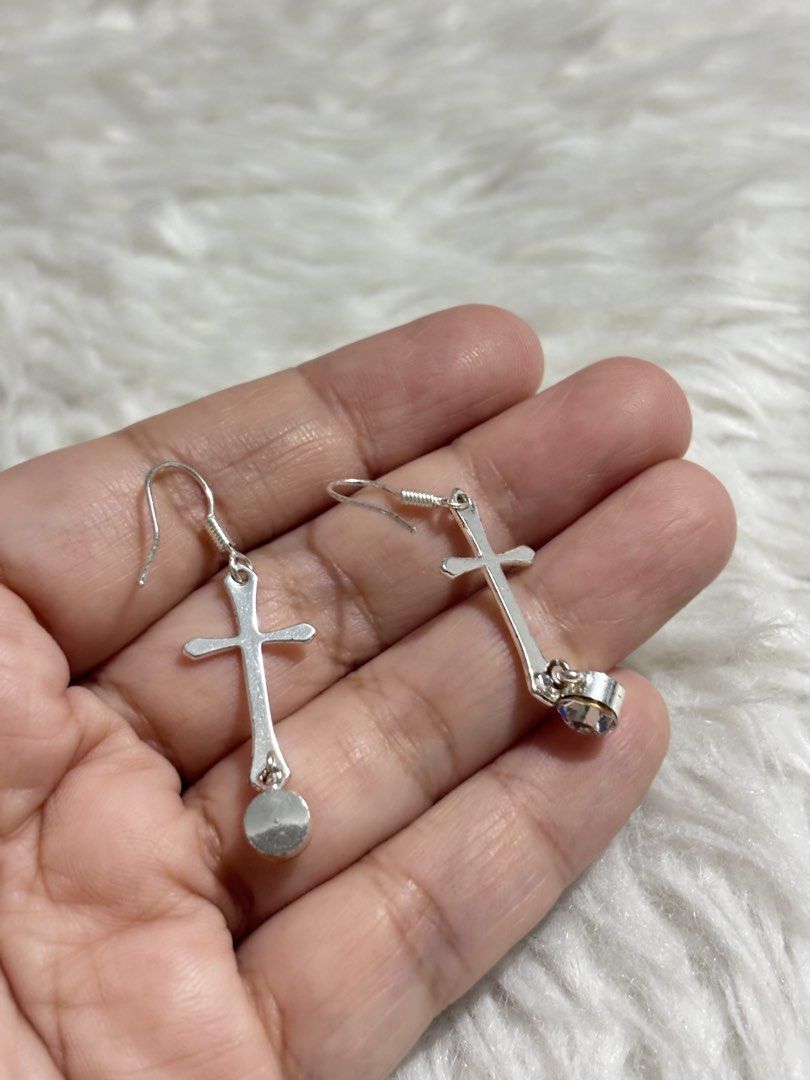 Silver-toned dangle earrings feature a classic Latin cross design (Category: Earrings) located in Paranaque City. Submitted by dalle_closet (Listing ID 1465932098, Image 3). Description: slightly used pa.