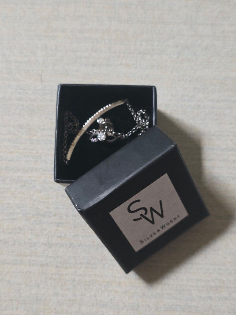 Silverworks Ring and Curved Bar Bracelet Set (Category: Bracelets) located in Quezon City. Submitted by mgmartin (Listing ID 1465782928, Image 1). Description: Silverworks ring and slider Bracelet set Ring details: Size 6 witg a sparkling main stone in sterling silver band Bracelet details: Curved bar encrusted with tiny stones and an adjustable chain for a custom fit Comes in the original black Silverworks box with logo.
