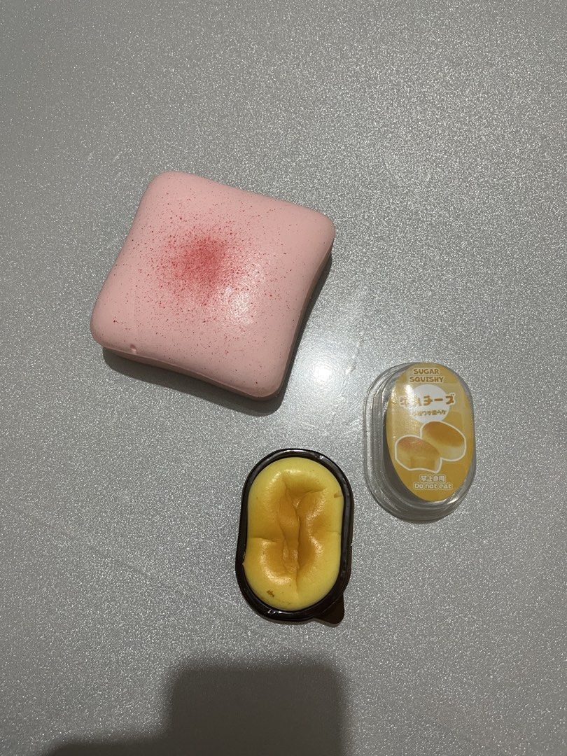 Slow Rising Squishies (Category: Kids Toys) located in Quezon City. Submitted by fracslaa (Listing ID 1465800412, Image 3). Description: - Set includes 2 super soft squishy toys - Pink cake-style squishy with red speckles - Mini yellow cheese squishy in original packaging - Great tactile toys for stress relief and collection - Selling as a bundle only.
