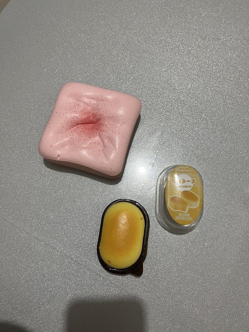 Slow Rising Squishies (Category: Kids Toys) located in Quezon City. Submitted by fracslaa (Listing ID 1465800412, Image 2). Description: - Set includes 2 super soft squishy toys - Pink cake-style squishy with red speckles - Mini yellow cheese squishy in original packaging - Great tactile toys for stress relief and collection - Selling as a bundle only.