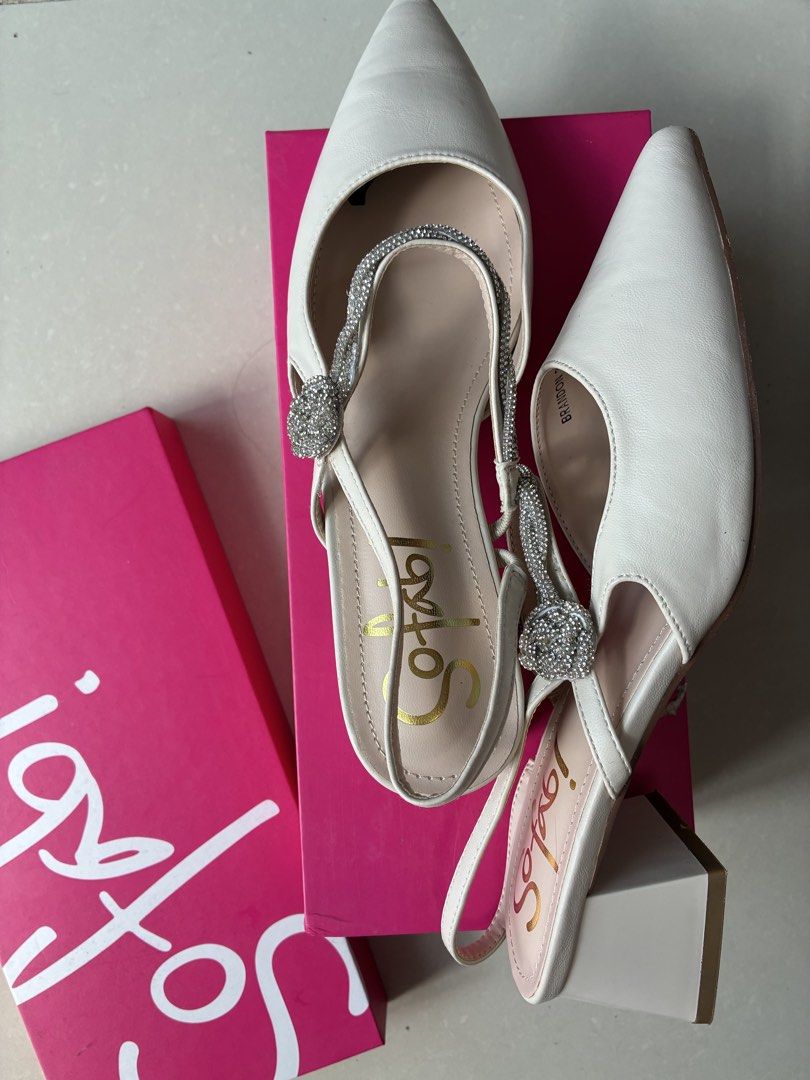 Sofab White Slingback Heels with Rhinestone Strap Size 39 (Category: Heels) located in Manila. Submitted by jhie24 (Listing ID 1465803772, Image 2). Description: Negotiable! - Brand: Sofab - Style: White slingback heels with pointed toe and block heel - Details: Sparkly rhinestone strap with a cute knotted bow accent - Size: 39 (stamped on sole) - Condition: Clean overall condition, minor wear on soles from trying on - Inclusions: Original pink S