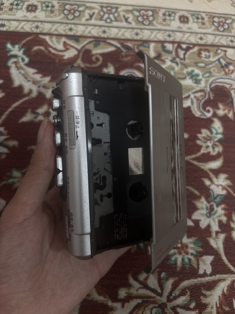 Sony Cassette Player TCM-450 (Category: Portable Music Players) located in General Trias. Submitted by victorias.declutter (Listing ID 1465942003, Image 3). Description: - Model: Silver Sony TCM-450 Cassette Recorder - Features: Clear Voice function, built-in speaker, volume wheel, and speed control dial - Controls: Smooth tape compartment with side-mounted play, record, fast forward, and rewind buttons - Inclusions: Comes with 2 cassette tapes (