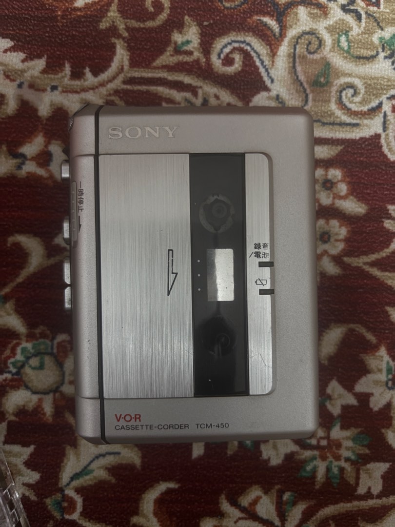 Sony Cassette Player TCM-450 (Category: Portable Music Players) located in General Trias. Submitted by victorias.declutter (Listing ID 1465942003, Image 2). Description: - Model: Silver Sony TCM-450 Cassette Recorder - Features: Clear Voice function, built-in speaker, volume wheel, and speed control dial - Controls: Smooth tape compartment with side-mounted play, record, fast forward, and rewind buttons - Inclusions: Comes with 2 cassette tapes (
