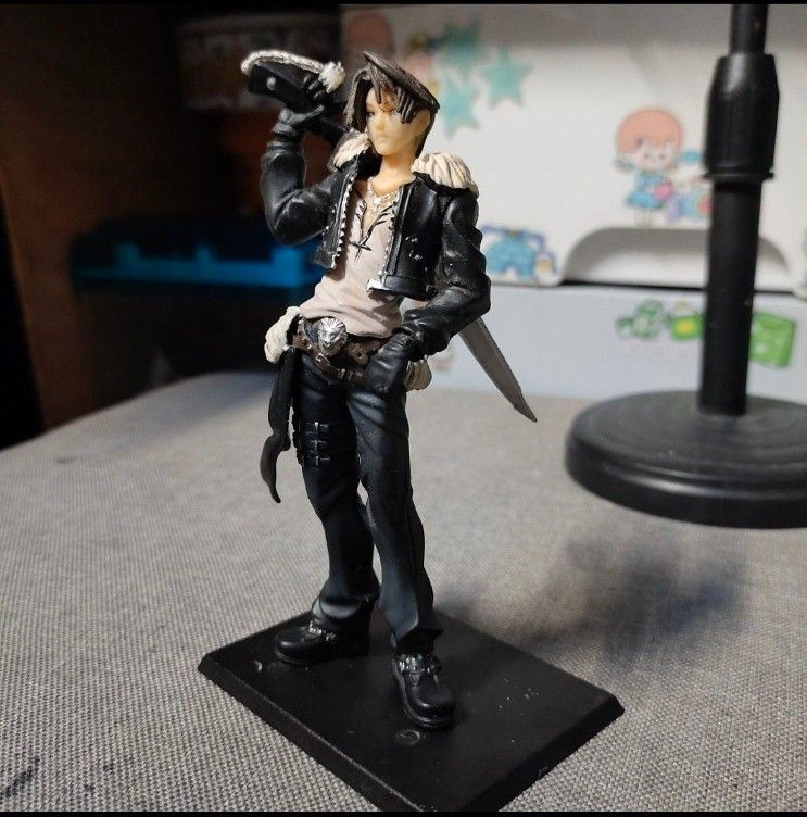 Squall Leonhart Final Fantasy VIII Trading Figure (Category: Figurines & Statues) located in Quezon City. Submitted by dncpreloved (Listing ID 1465772401, Image 1). Description: - Authentic Squall Leonhart figure from Final Fantasy VIII - Detailed sculpt featuring his signature gunblade - Iconic black jacket with fur collar and grey pants - Includes original black base stand (stands firmly upright) - Condition: Minor paint wear and dust from disp
