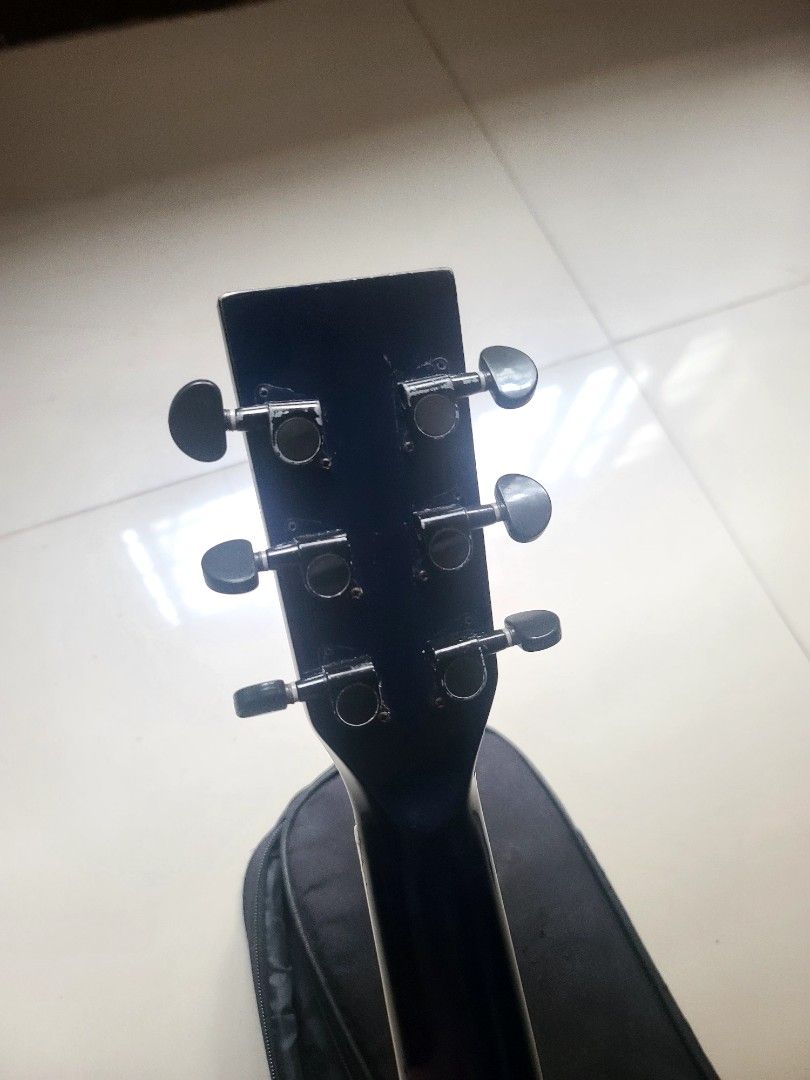 Acoustic Guitar (Category: Musical Instruments) located in Manila. Submitted by soidontneedthisanymore (Listing ID 1465852544, Image 3). Description: - Glossy black finish acoustic guitar - Includes a matching black gig bag -stainless fretwires, mahogany fretboard, rosewood brigde - Shows normal wear on the body and case from previous playing - Ideal practice instrument for beginners and casual players .