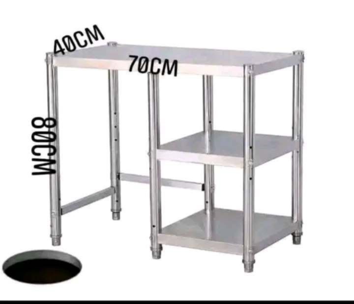 STOVE STAND STAINLESS 70x40x80cm (Category: Tables & Sets) located in Manila. Submitted by berdenmarl01688 (Listing ID 1465946478, Image 2). Description: - Material: Durable stainless steel with a solid metal build - Dimensions: 70cm (L) x 40cm (W) x 80cm (H) - Storage: Two lower side shelves for extra organization - Space-saving: Multi-tier vertical design maximizes kitchen space - Maintenance: Easy to wipe clean - Note: Assembly required.