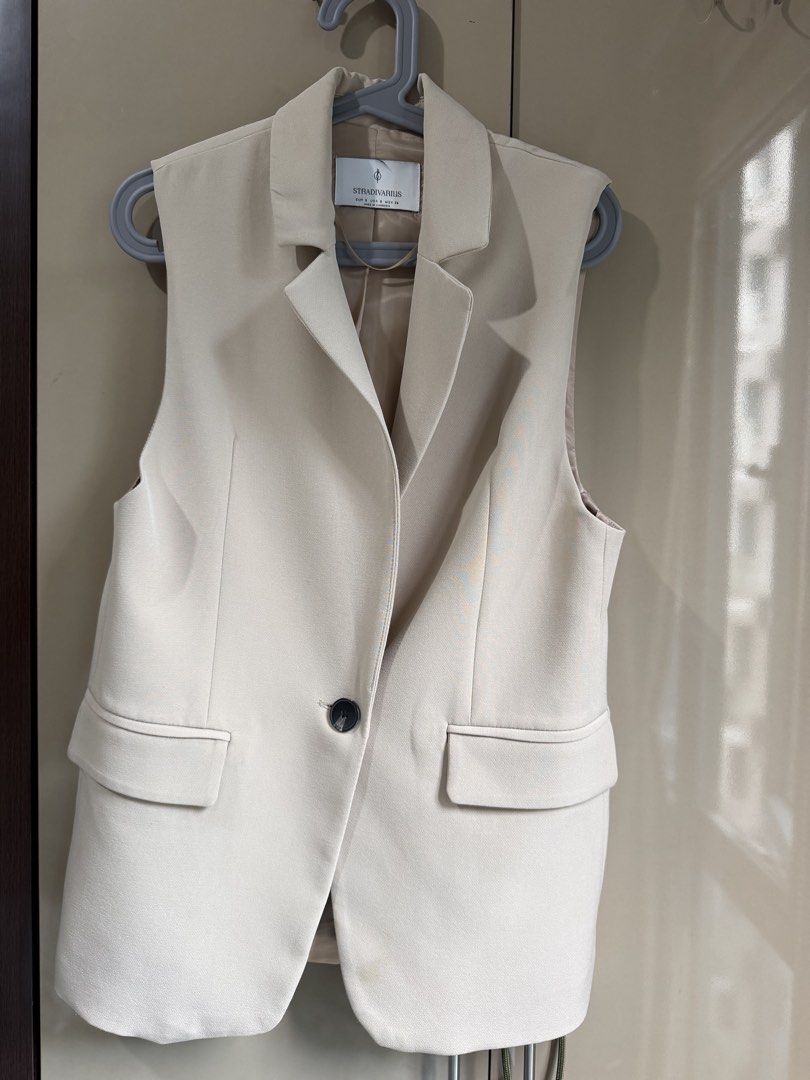 Stradivarius Tailored Beige Blazer Vest Size S (Category: Coats, Jackets and Outerwear) located in Pasay City. Submitted by closetbykim (Listing ID 1465788870, Image 3). Description: - Brand: Stradivarius - Size: S - Color: Versatile beige / neutral - Style: Sleeveless blazer vest with lapel collar and single front button closure - Perfect for: Smart casual outfits, office wear, and stylish layering.