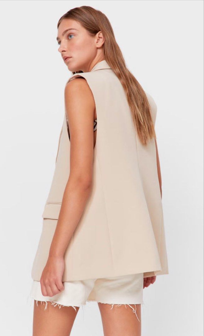 Stradivarius Tailored Beige Blazer Vest Size S (Category: Coats, Jackets and Outerwear) located in Pasay City. Submitted by closetbykim (Listing ID 1465788870, Image 2). Description: - Brand: Stradivarius - Size: S - Color: Versatile beige / neutral - Style: Sleeveless blazer vest with lapel collar and single front button closure - Perfect for: Smart casual outfits, office wear, and stylish layering.