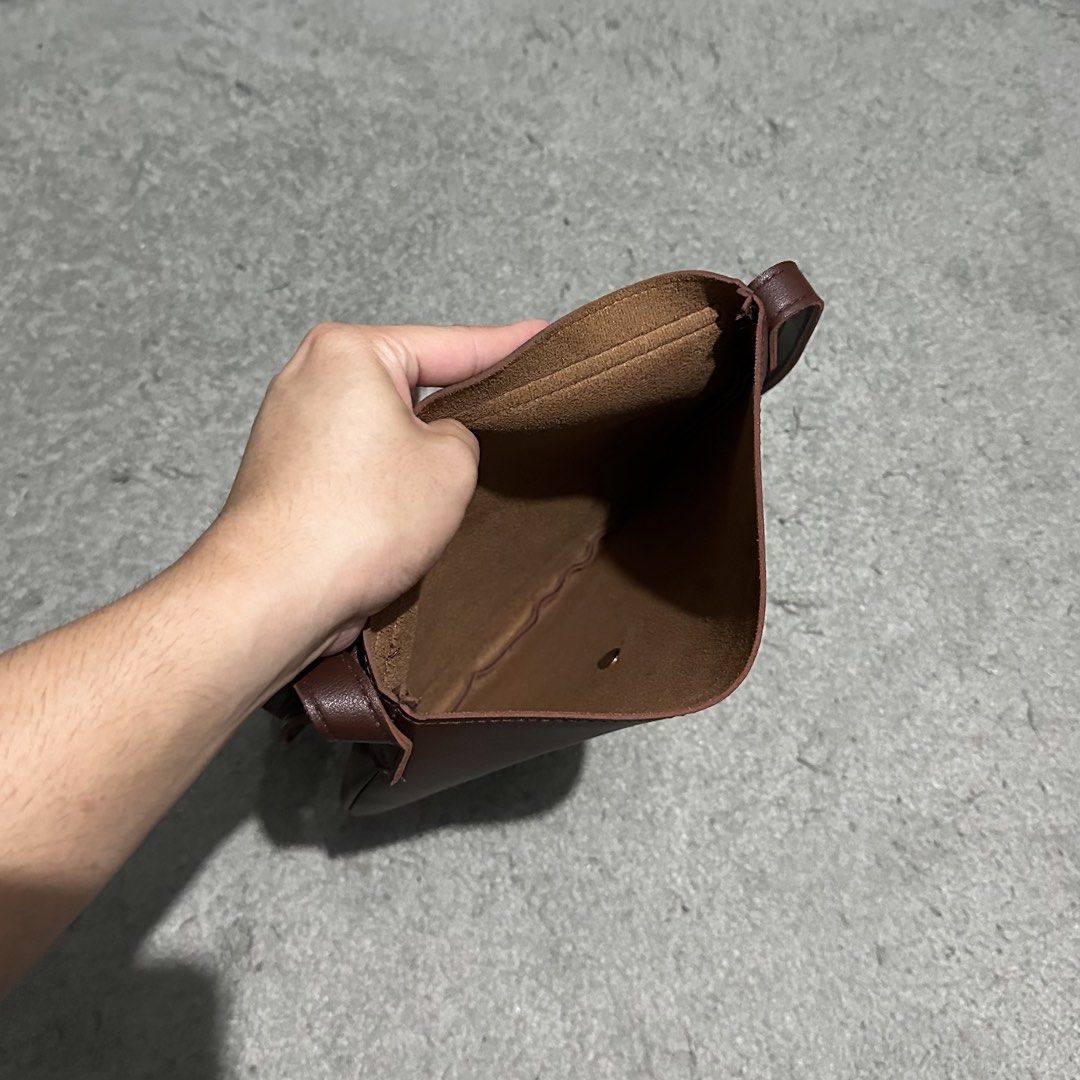 Straightforward Brown Leather Crossbody Bag (Category: Sling Bags) located in Lipa City. Submitted by jecoparra (Listing ID 1465836143, Image 3). Description: - Brand: Straightforward - Material: Smooth faux leather - Color: Brown - Style: Structured saddle shape with minimalist design - Closure: Front flap with magnetic snap - Strap: Adjustable shoulder strap - Storage: Single open main compartment and convenient back slip pocket - Condition: Cl