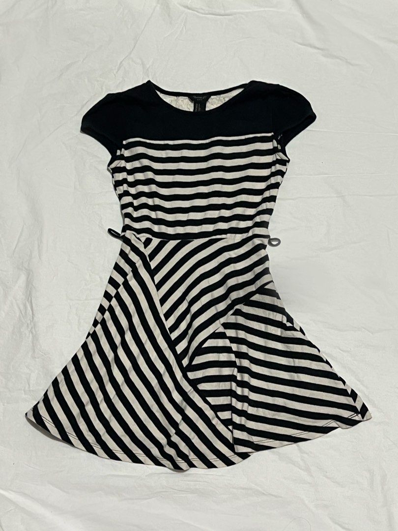 Striped Fit & Flare Mini Dress (Category: Dresses) located in Quezon City. Submitted by jvnelie (Listing ID 1465860151, Image 1). Description: B2 | Striped Fit & Flare Mini Dress Code: B2 Size: S Price: ₱150 Description: Playful Forever 21 black and white striped mini dress with mixed-direction stripe paneling and cap sleeves. Features an A-line skater fit that cinches at the waist. Condition: Good preloved condition. Style Keywords: #Y2K #MiniDr