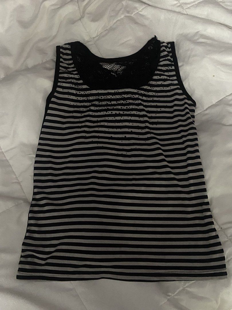 stripes black and grey lace bedazzled (Category: Sleeveless) located in Marikina City. Submitted by scarkiv (Listing ID 1465935288, Image 1). Description: - Color: Black and grey horizontal stripes - Style: Sleeveless scoop neck tank top - Details: Sheer black mesh chest insert with scattered rhinestone embellishments - Fit: Stretchy, comfortable, and breathable fabric - Condition: Brand new / Excellent (ready to wear) - Perfect for: Casual every