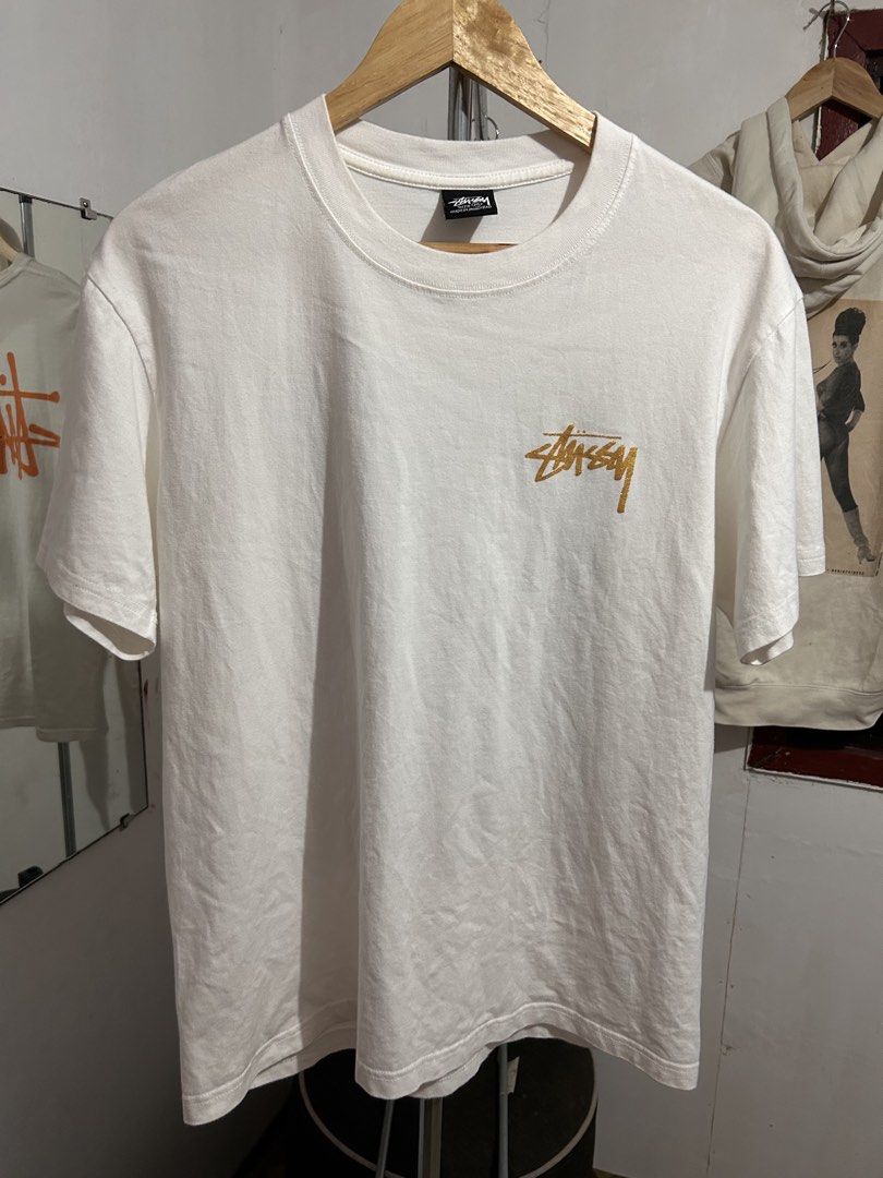 Stussy Knowledge King White Graphic Tee Size M (Category: Tshirts & Polo Shirts ) located in Manila. Submitted by livedog-d301 (Listing ID 1465878650, Image 2). Description: - Brand: Stussy - Size: Medium - Color: White - Material: 100% Cotton (Made in Honduras) - Design: Small gold chest logo, large black & white classroom graphic on the back with gold text - Condition: Excellent pre-loved condition - Mode of Payment: GCash, Bank Transfer - Ship