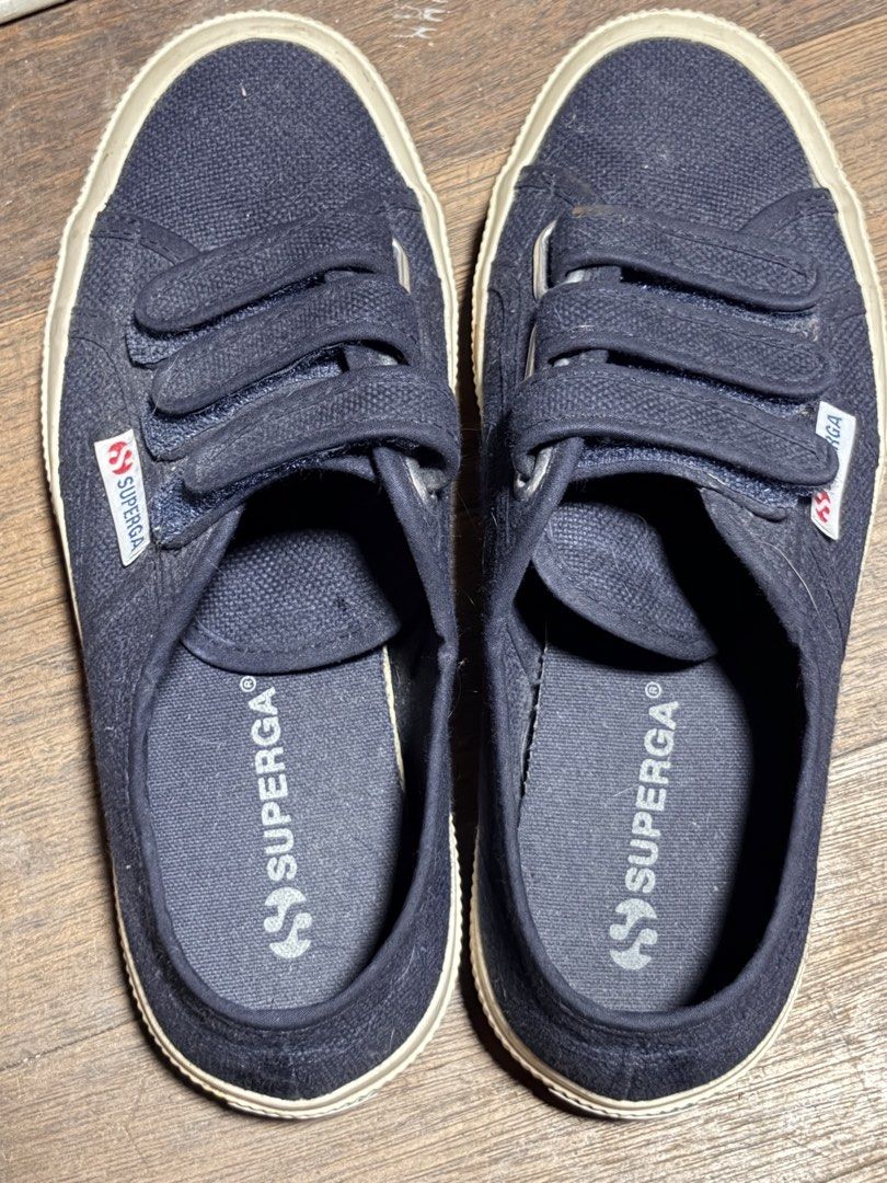 Superga Dark Navy Velcro Canvas Sneakers (Category: Sneakers) located in Caloocan City. Submitted by ronnikins (Listing ID 1465860480, Image 1). Description: - Brand: Superga - Color: Dark navy blue - Closure: Triple hook-and-loop straps - Sole: White rubber sidewalls - Details: Signature branding on sides and insoles - Design: Low-top with comfortable fabric lining - Condition: Used a few times, box got wet so had to throw it away RFS: Declutter