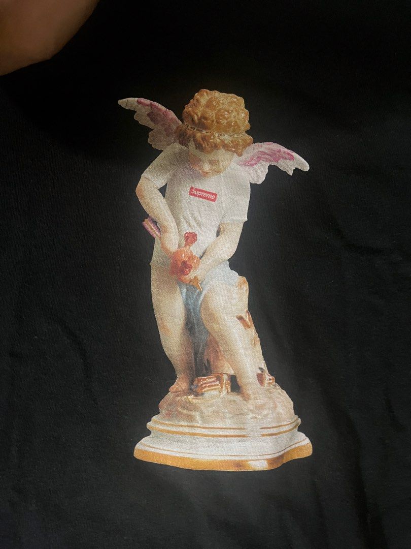 Supreme Cupid Tee (Authentic) (Category: Tshirts & Polo Shirts ) located in Manila. Submitted by guccimanedeua (Listing ID 1465913948, Image 2). Description: Supreme Cupid Tee (Authentic) Size: L Issue: Check pics.