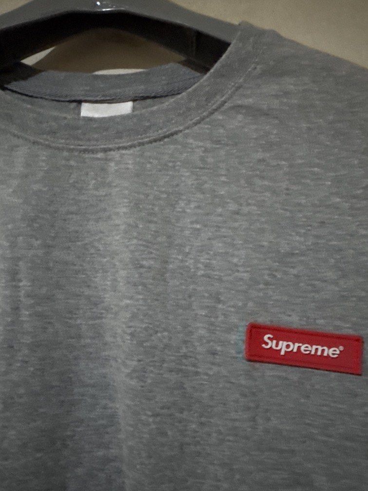 Supreme Tee (Category: Tshirts & Polo Shirts ) located in Danao, Cebu. Submitted by welvirinec29053 (Listing ID 1465780350, Image 2). Description: The image shows a grey Suppreme short-sleeve t-shirt featuring a large, slanted "Sup" graphic printed in black across the front. dimes 21x27 color rate 9.8/10 size L fit to medium.