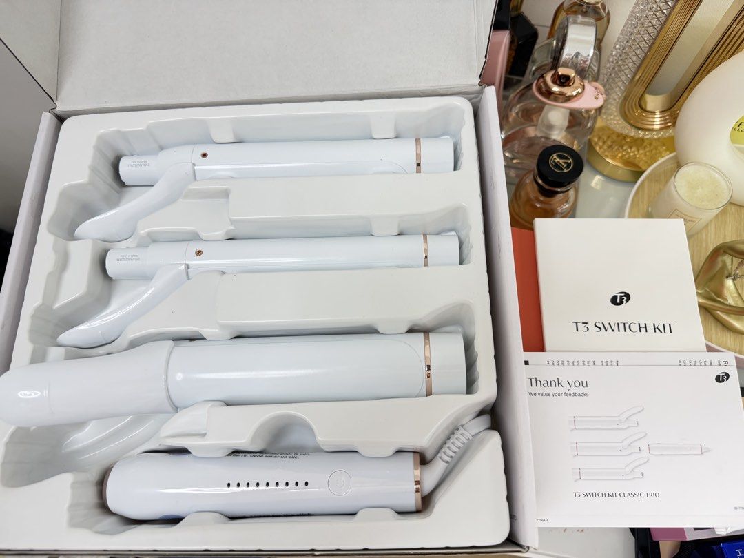 T3 Switch Kit Classic Trio Interchangeable Curling Iron (Category: Hair) located in Mandaluyong City. Submitted by ricamaesan37823 (Listing ID 1465948403, Image 2). Description: - Authentic T3 Switch Kit Classic Trio styling iron set - Includes base handle and 3 interchangeable ceramic barrels for multiple curl styles - Fast twist-and-switch barrel replacement design - 9 customizable heat settings for precise temperature control - Ceragloss ceram