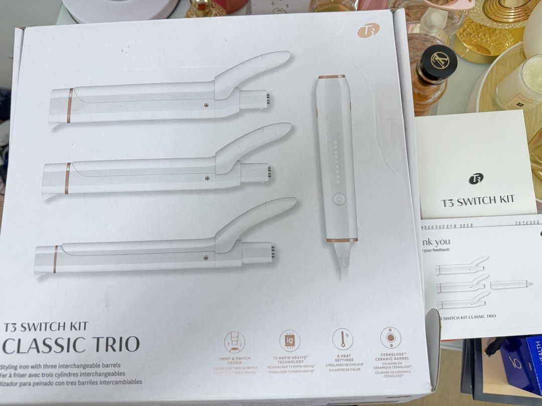 T3 Switch Kit Classic Trio Interchangeable Curling Iron (Category: Hair) located in Mandaluyong City. Submitted by ricamaesan37823 (Listing ID 1465948403, Image 1). Description: - Authentic T3 Switch Kit Classic Trio styling iron set - Includes base handle and 3 interchangeable ceramic barrels for multiple curl styles - Fast twist-and-switch barrel replacement design - 9 customizable heat settings for precise temperature control - Ceragloss ceram