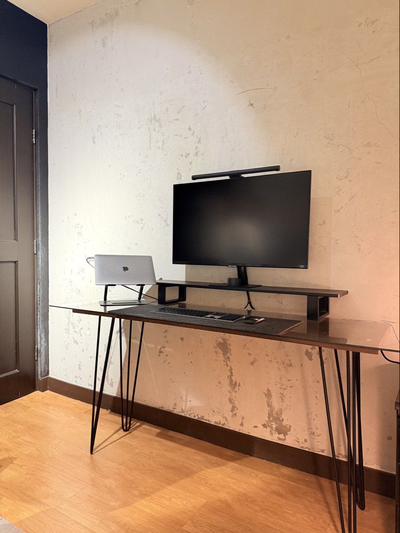 Table with glasstop (Category: Tables & Sets) located in Taguig. Submitted by boxedgoodies (Listing ID 1465881616, Image 1). Description: - Desk with glass top and stylish black metal hairpin legs - Solid Mahogany wood in Walnut finish - Leg height is 70cm - Wood is 40cmx138cm - Wood thickness is 1in - Glasstop is 48cmx 155cm.